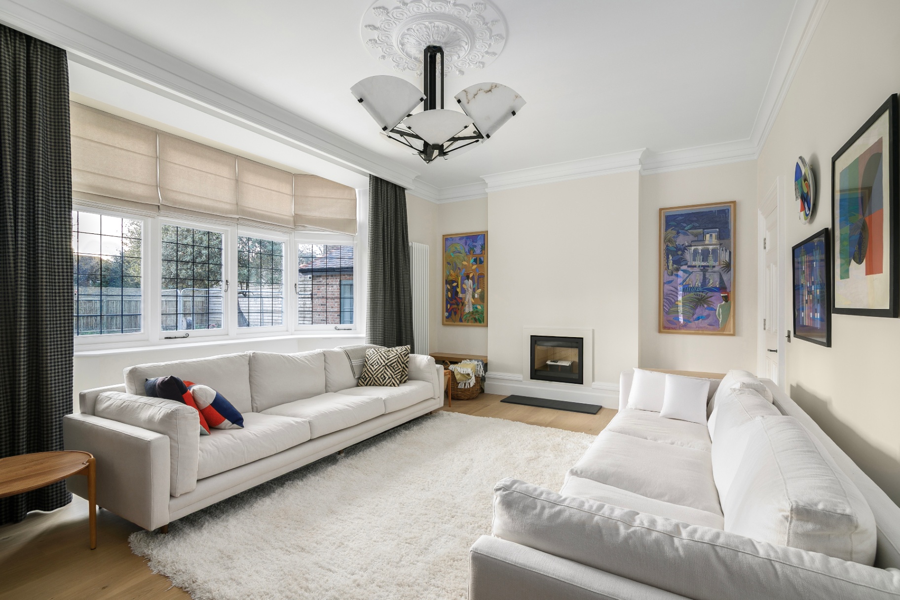 Richmond living room with white sofas and fireplace